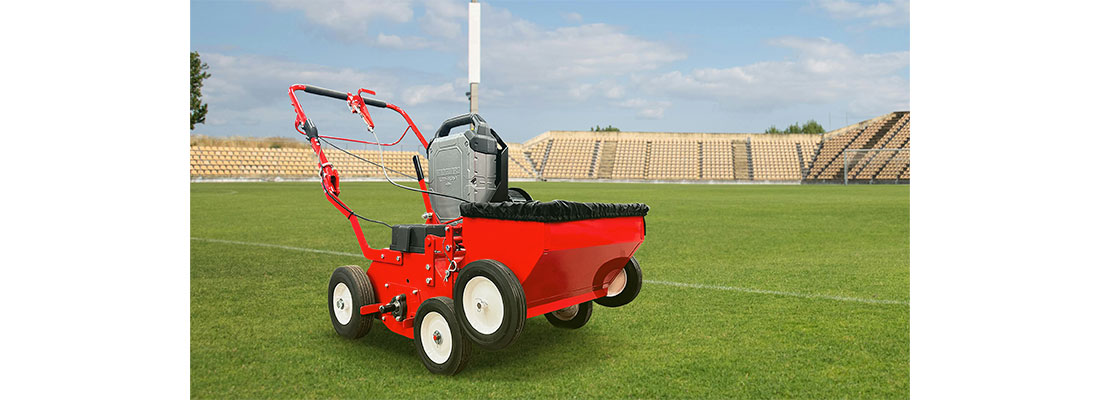 A Vanguard 48V 1.5kWh* Commercial Battery Pack powering an overseeder.